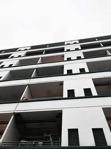 high rise low angle photo of concrete building town